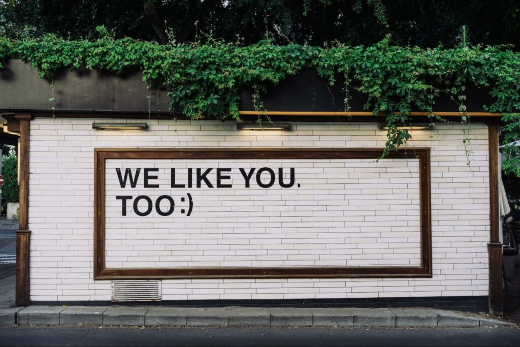 We like you too banner on street